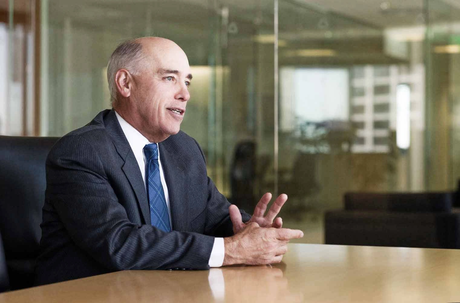 Executive portrait of a board member during a discussion in a Copenhagen office – Executive Portrait Photographer Copenhagen
