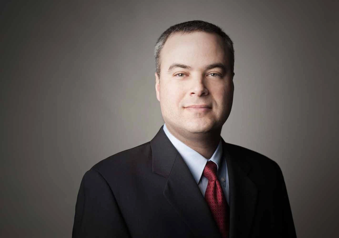 Studio executive portrait of a business executive in a dark suit and red tie – Executive Portrait Photographer Copenhagen