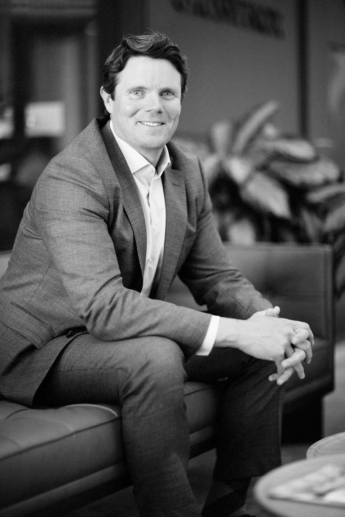 Black and white executive portrait of a business manager sitting in a lounge – Executive Portrait Photographer Copenhagen