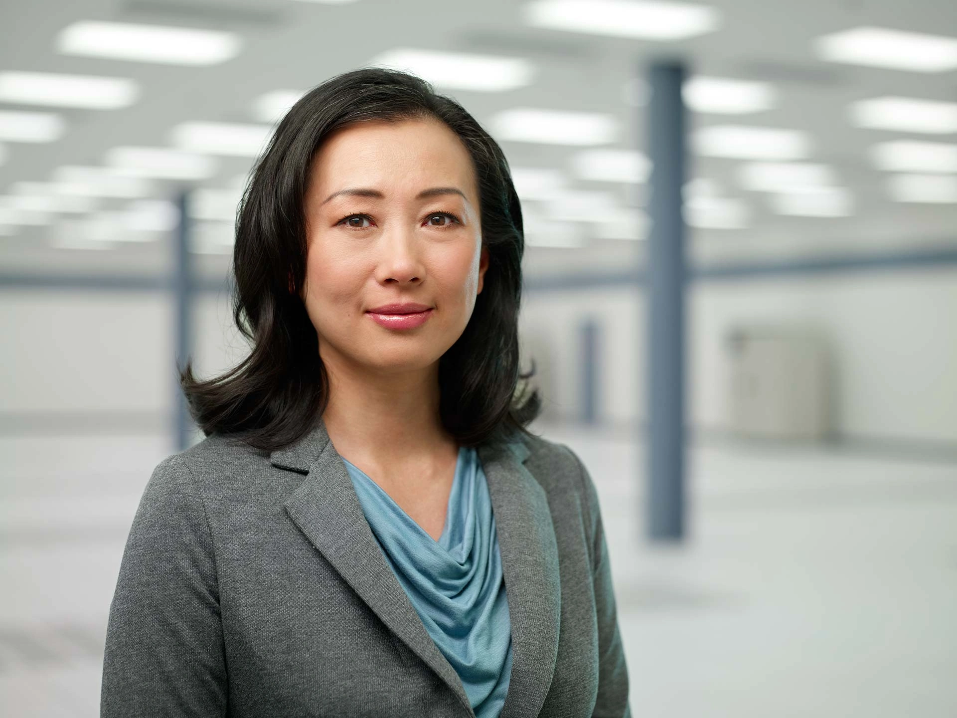 Executive portrait of a female executive in a grey blazer – Executive Portrait Photographer Copenhagen