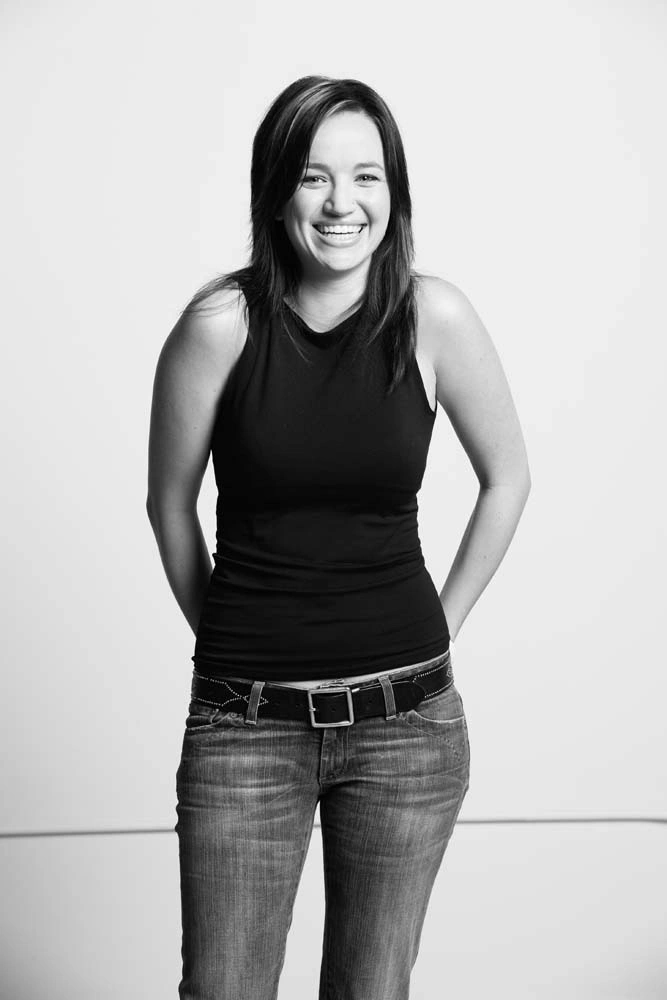 Black and white executive portrait of a smiling female professional – Executive Portrait Photographer Copenhagen