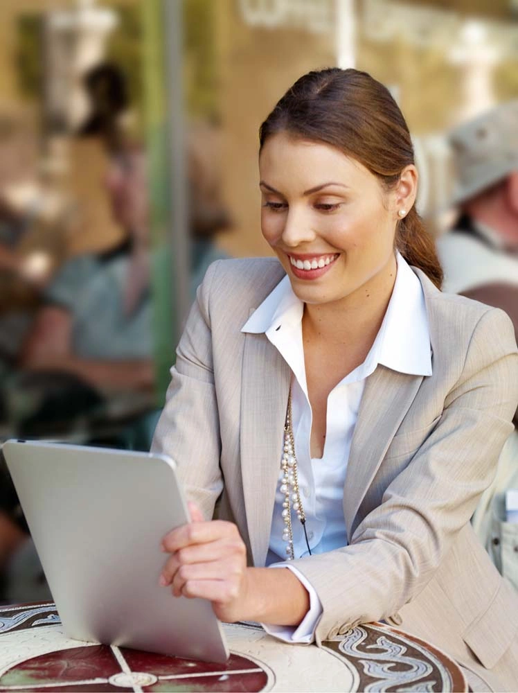 Lifestyle executive portrait of a professional working on a tablet in a Copenhagen cafe – Executive Portrait Photographer Copenhagen