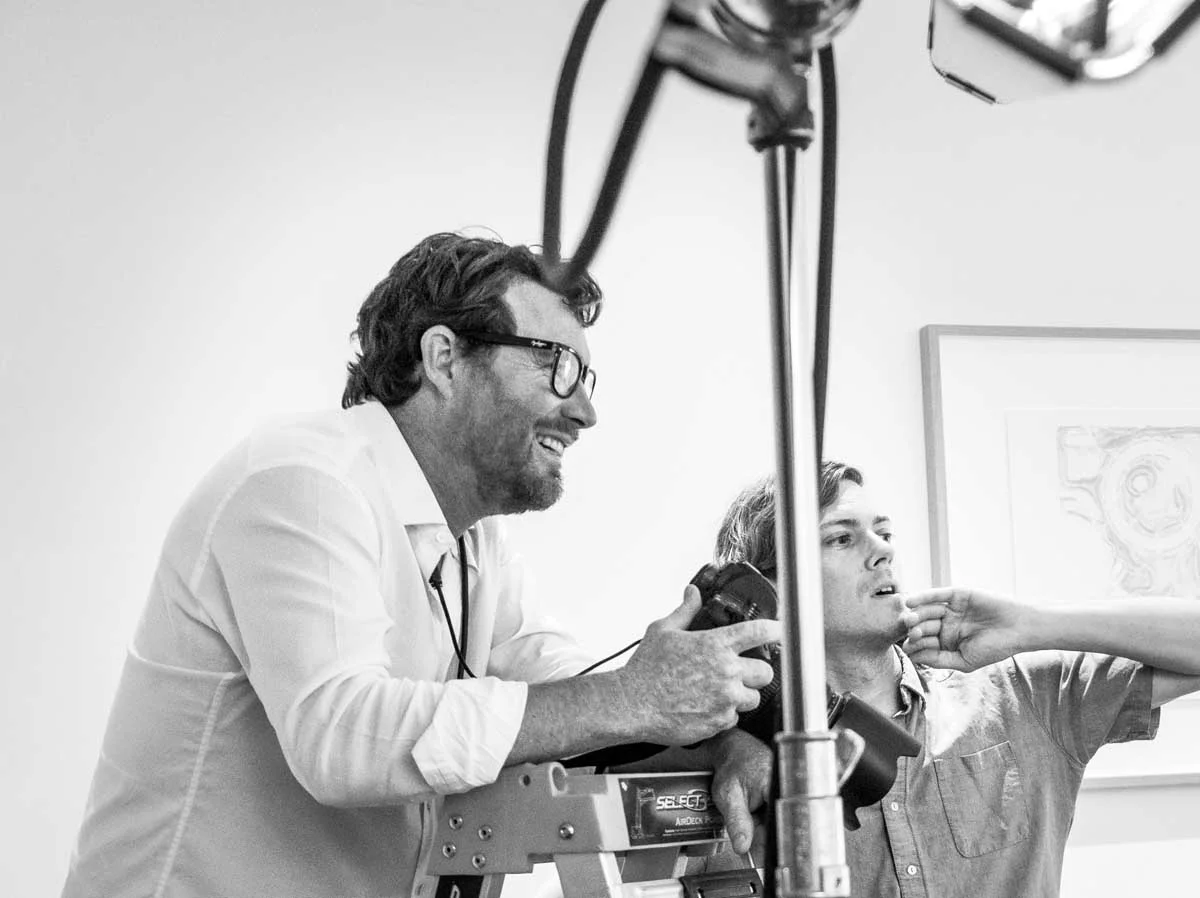 Executive portrait photographer directing a subject during a portrait session in Copenhagen