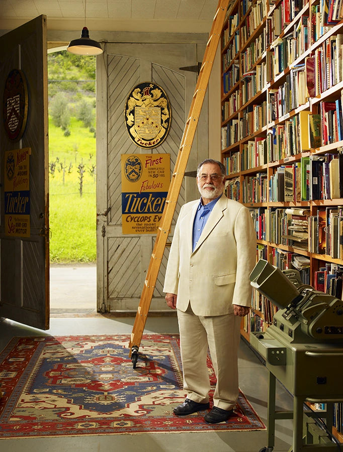 Full length personal branding portrait of Francis Ford Coppola in a library with vintage film equipment – Personal Branding Portrait Photographer Copenhagen